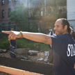 Ray Figueroa working with neighborhood youth to build raised beds for gardening