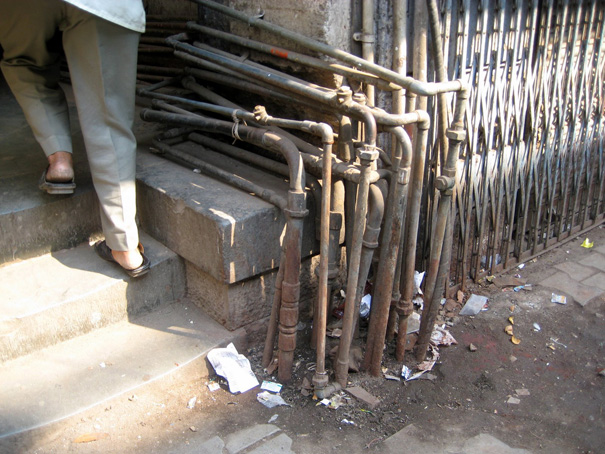 Photo of feet and pipes in Mumbai, India